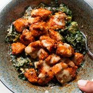 A picture of Crispy Buffalo Tofu with Caesar Salad