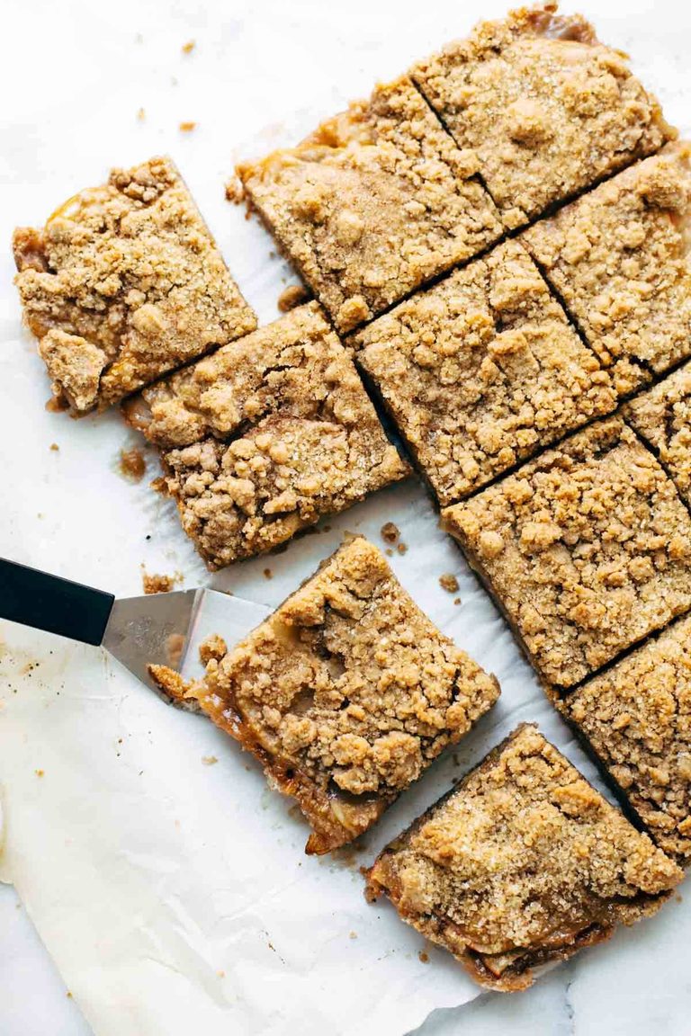 Caramel apple crisp bars with spatula.