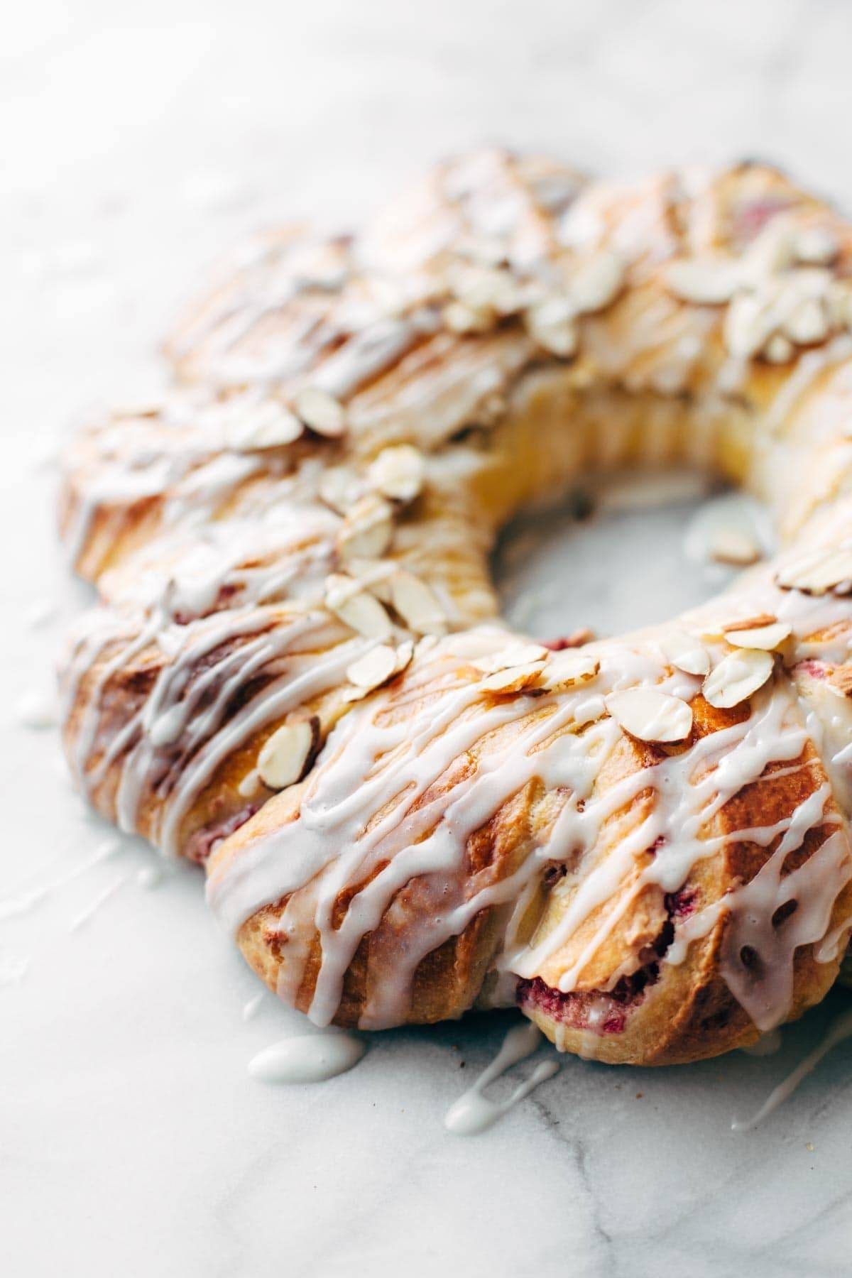 Christmas Tea Ring filled with Raspberry Cream Cheese Filling - the most beautiful Scandinavian-inspired recipe for holiday brunch! | pinchofyum.com