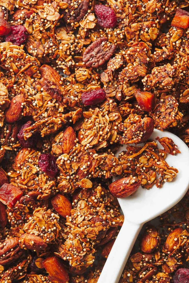 Maple quinoa granola with a spoon.