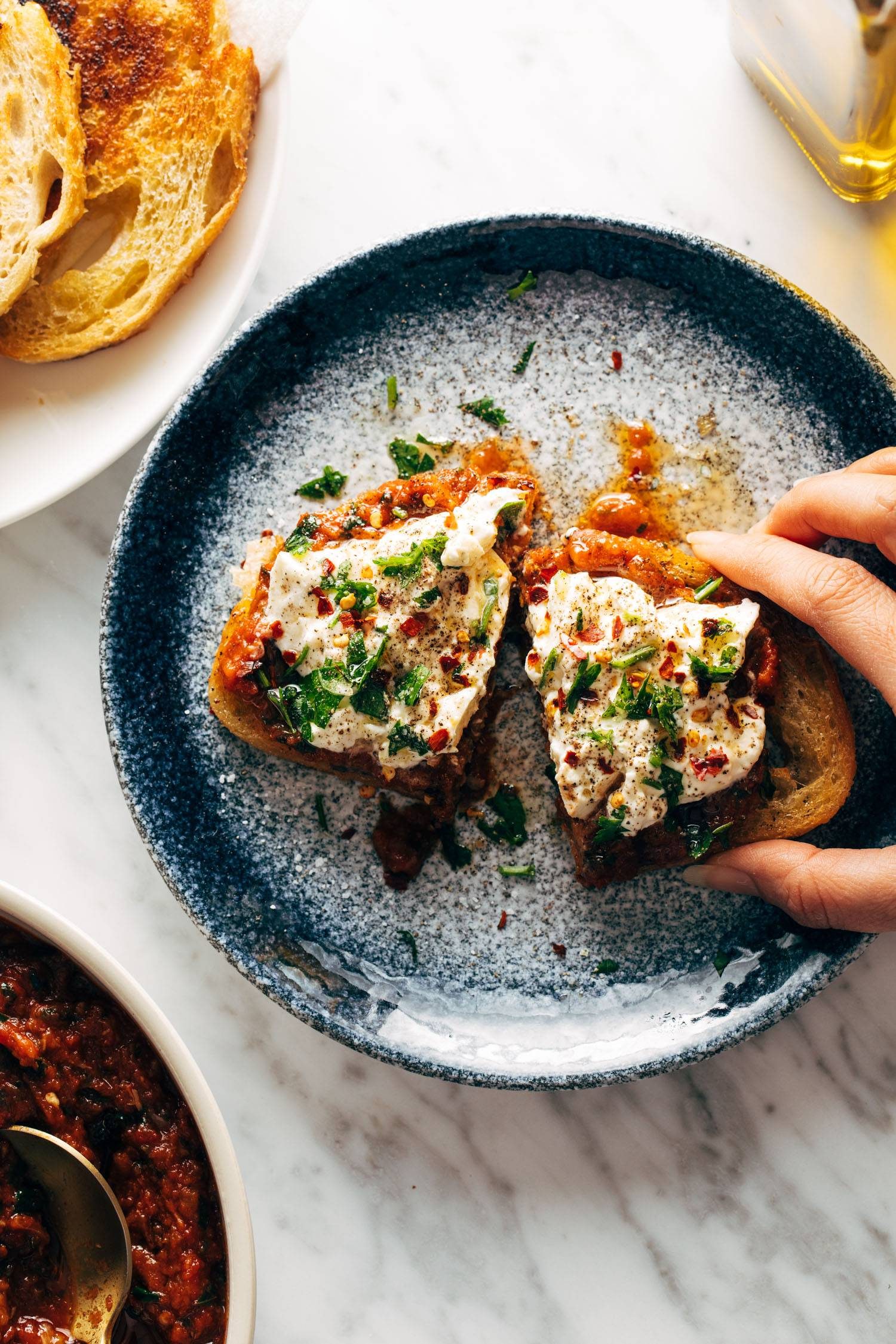 Zaalouk toasts on a plate.