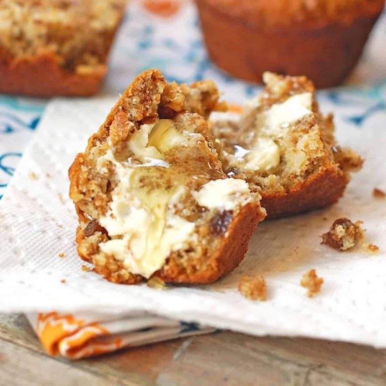 Raisin bran muffin with butter and honey.