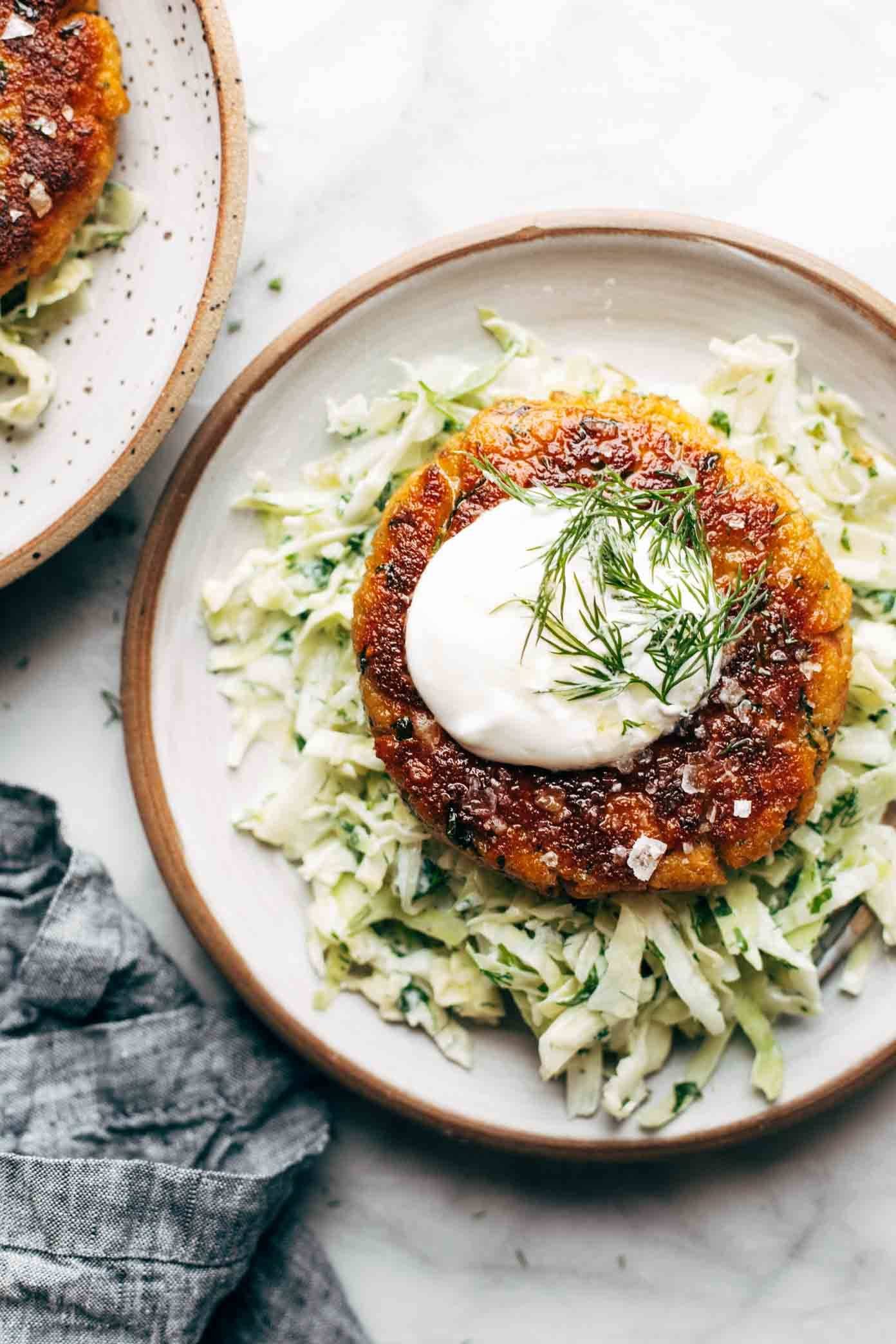 Salmon burger on slaw.